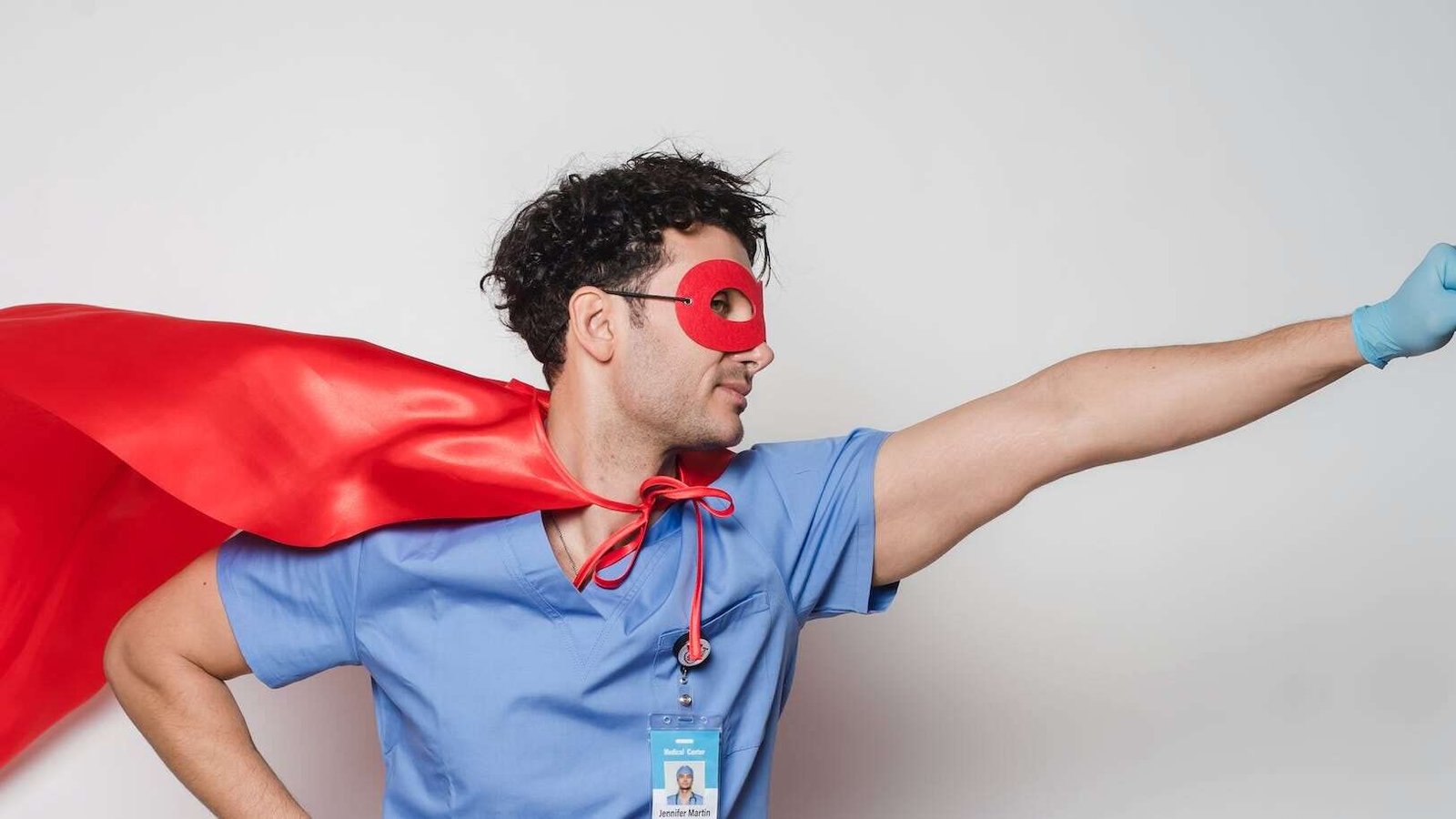 brave doctor in flying superhero cape with fist stretched