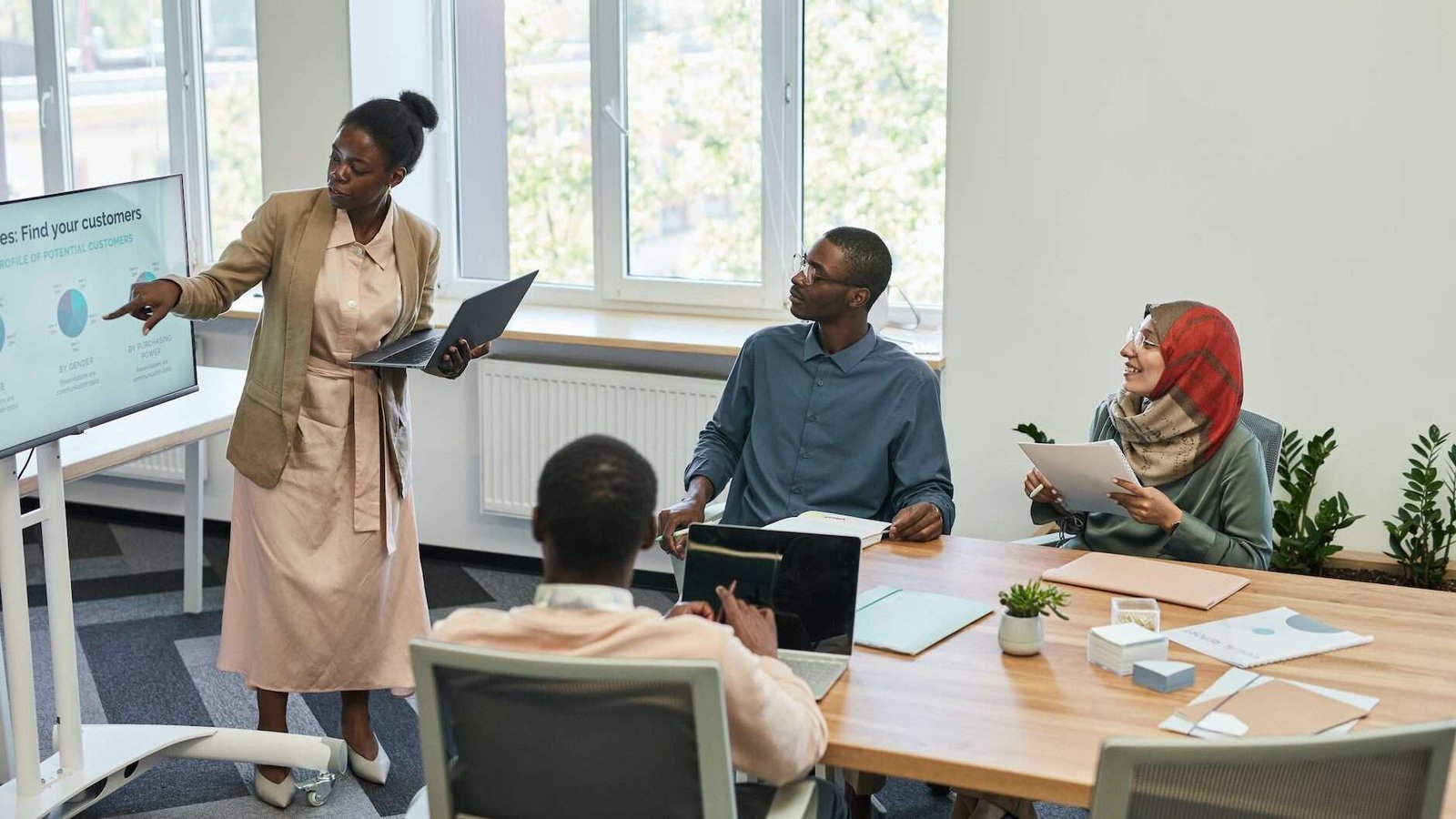 woman doing a presentation in an office meeting