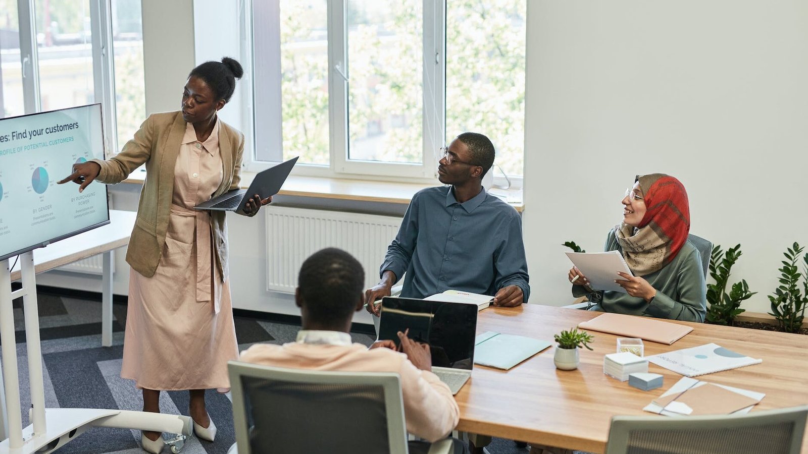 woman doing a presentation in an office meeting