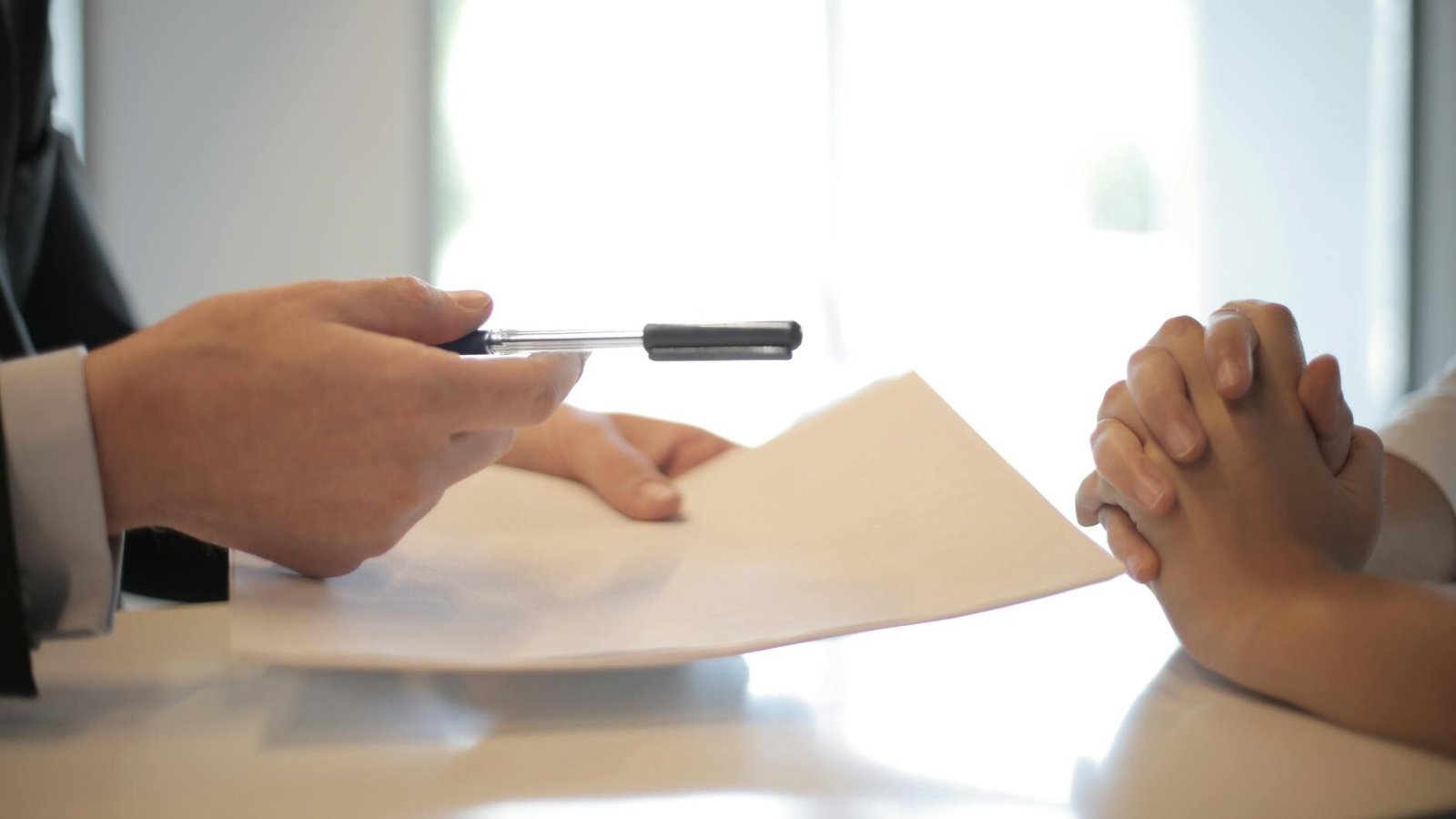 crop businessman giving contract to woman to sign